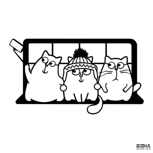 A playful black laser-cut 3mm MDF single-panel wall art featuring three funny cartoon cats taking a selfie, hanging over a contemporary living room sofa by Sirha Decor.