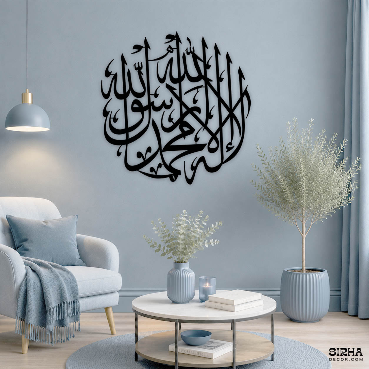 "A modern black circular 3mm MDF laser-cut Arabic calligraphy wall art piece featuring the Islamic Shahada by Sirha Decor."