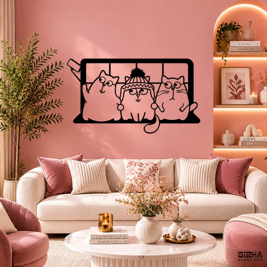 A playful black laser-cut 3mm MDF single-panel wall art featuring three funny cartoon cats taking a selfie, hanging over a contemporary living room sofa by Sirha Decor.