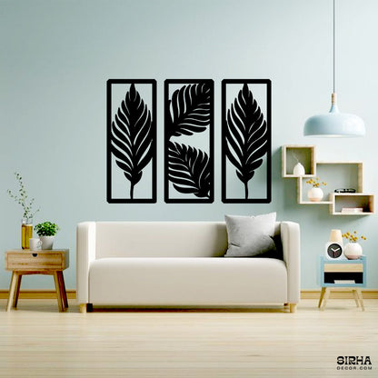 A beautiful 3-piece black laser-cut 3mm MDF rustic botanical wall art set featuring palm leaf patterns in rectangular panels by Sirha Decor.